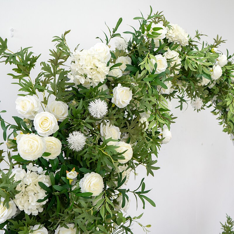 Decorating a hexagon wedding arch with flowers and fabric